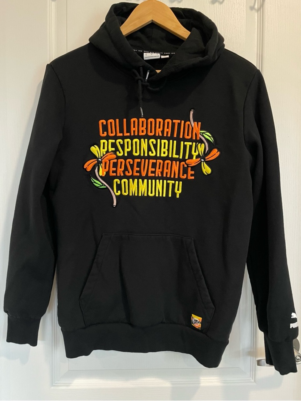 Black Graphic Hoodie with Orange & Yellow Text